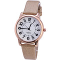 Women's simple dial quartz watch with beige leather strap showing 28mm face