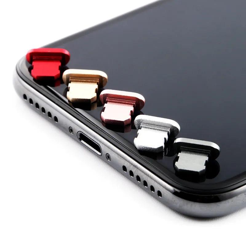 Aluminium alloy charging port dust plug for iPhone in various colours including gold, silver, and rose gold.