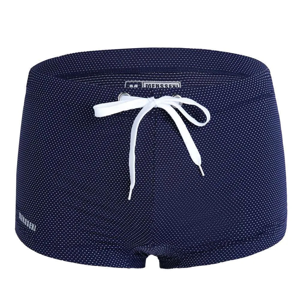 Men's low waist boxer style nylon swimming trunks in multiple solid colours