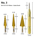 High-speed steel cone step drill bits and a centre punch set on a workshop bench