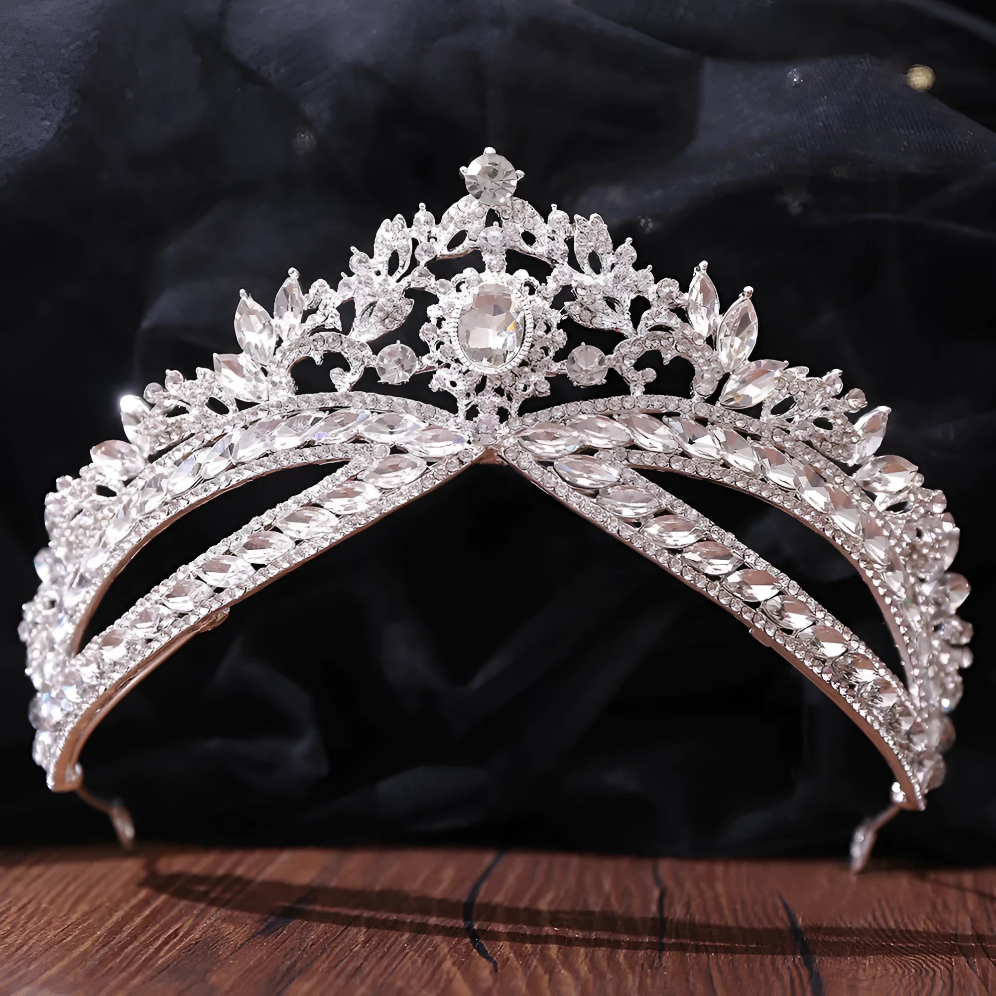 Wedding crown headdress with rhinestone and crystal in silver white finish on display