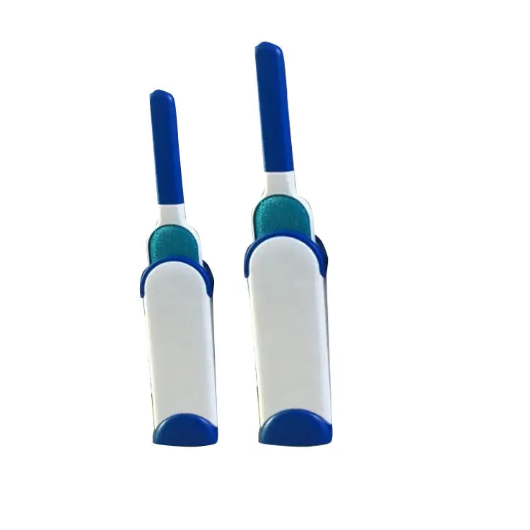 Blue reusable pet hair removal brush with a self-cleaning base, placed on a grey sofa.