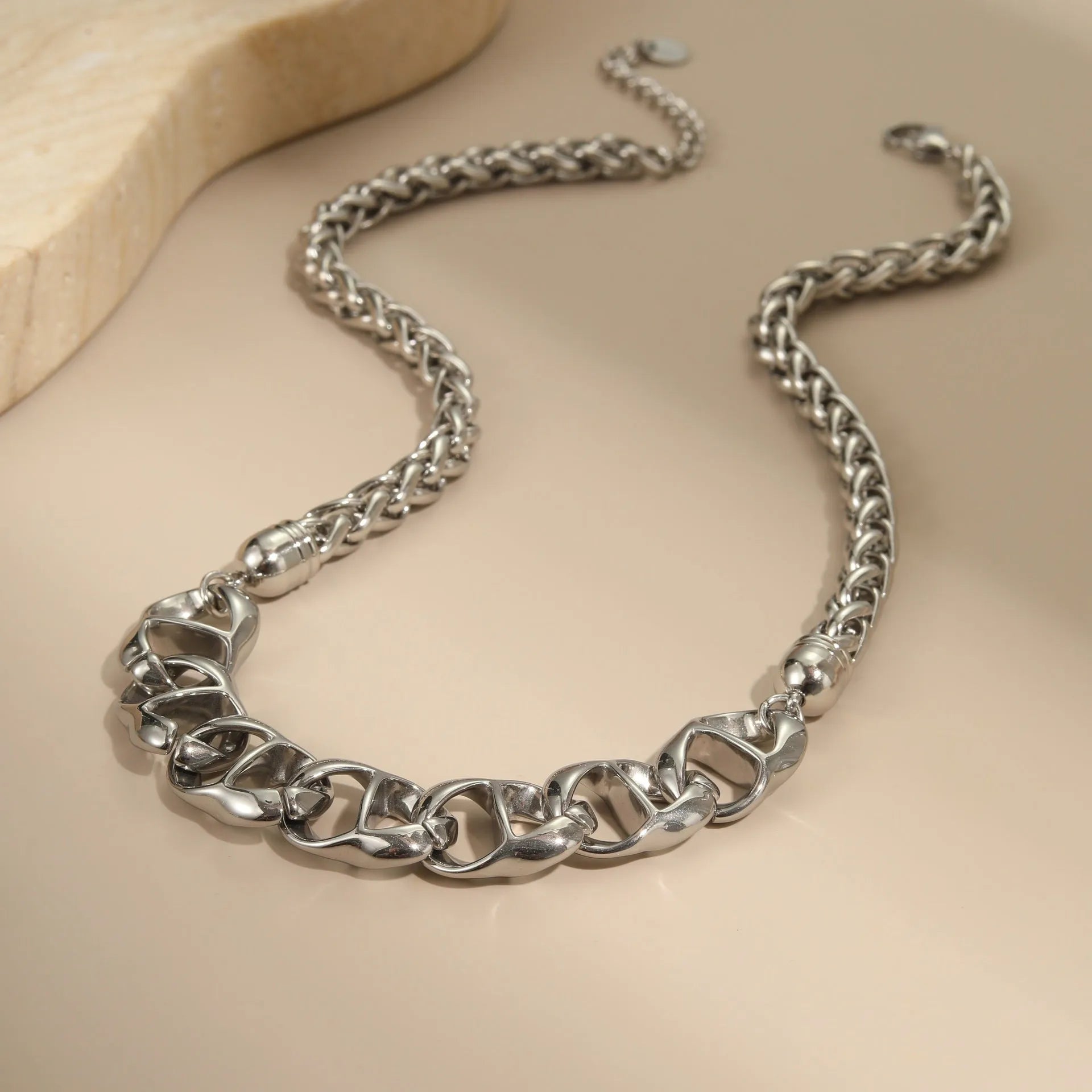 Stainless steel geometric pendant necklace with gold electroplating and chain design details