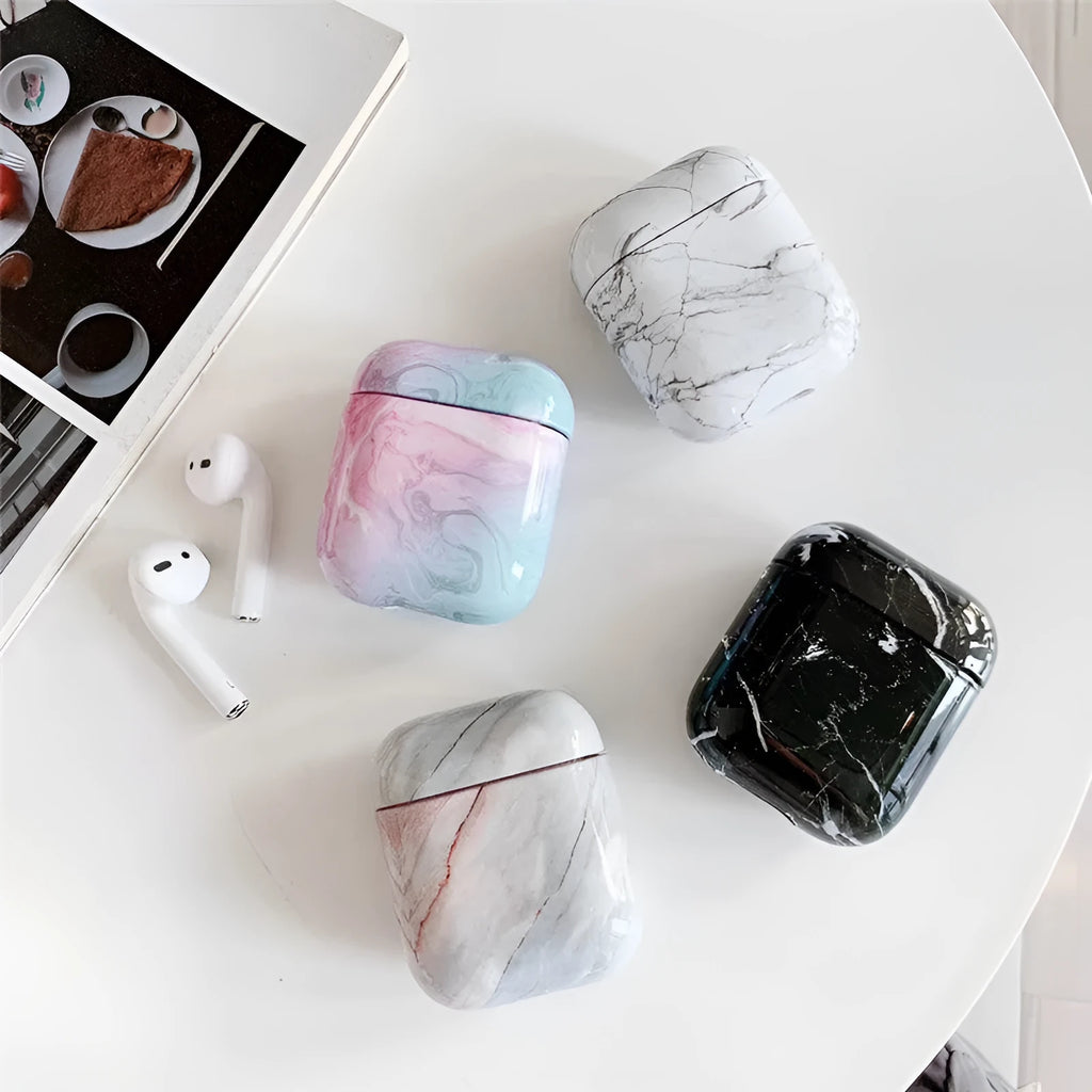 White marble protective case for Apple AirPods charging box showing hard PC construction
