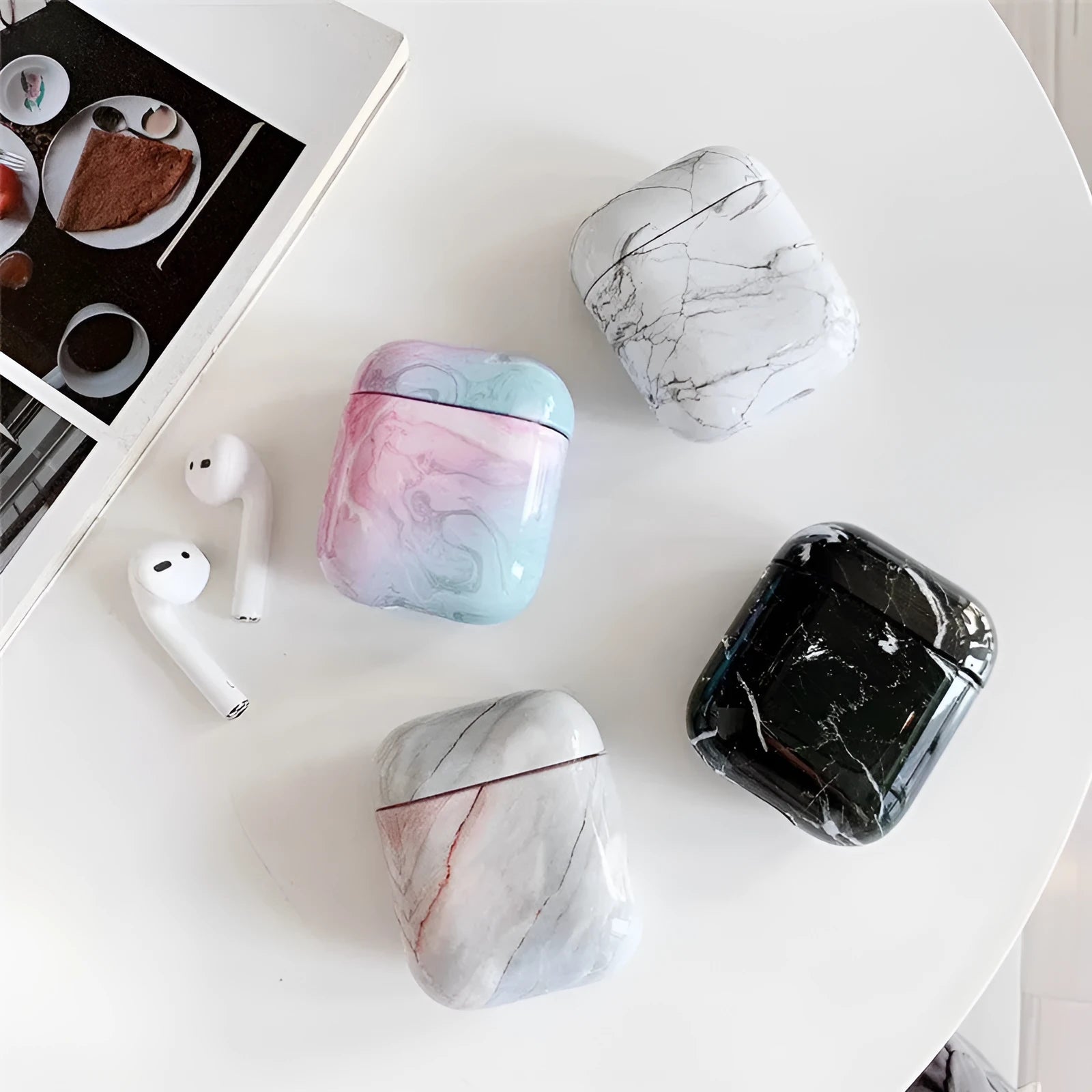 White marble protective case for Apple AirPods charging box showing hard PC construction