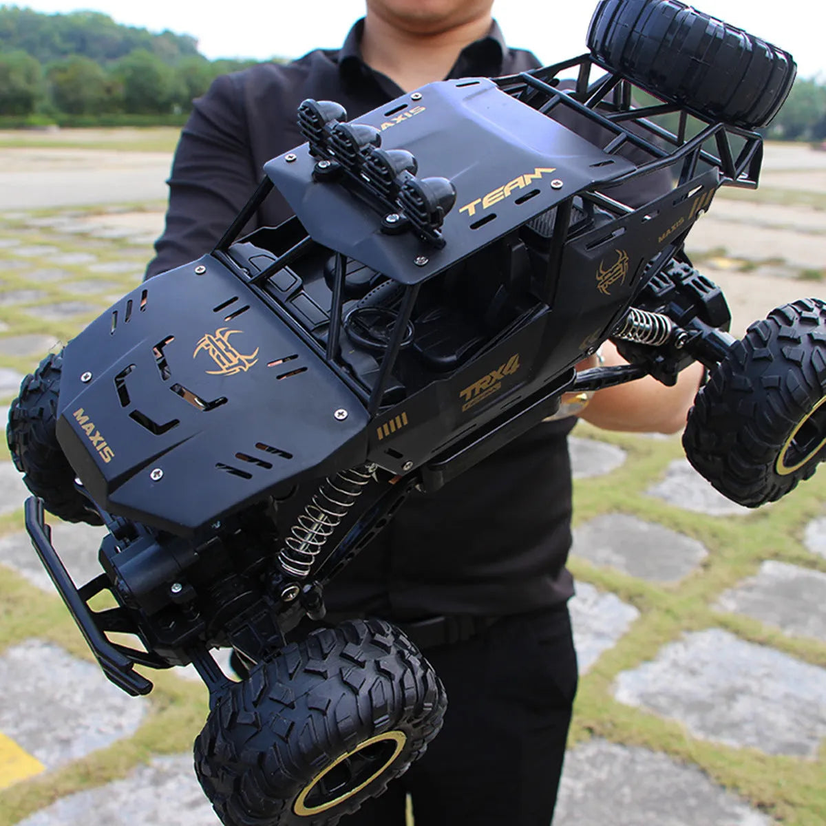 Large black 4WD remote control off-road climbing car with 2.4G wireless controller