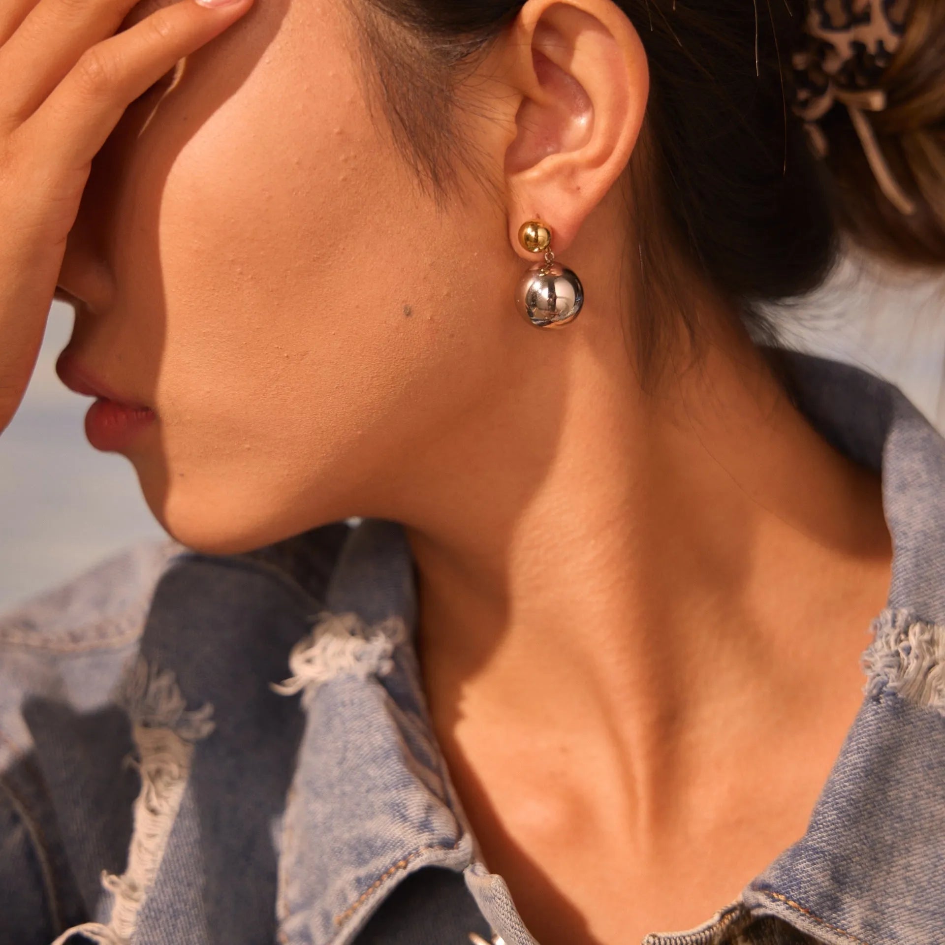 Stainless steel ear studs with 18K gold electroplating and round bead geometry design