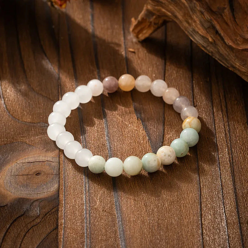 Vintage bohemian style natural stone bead necklace and bracelet set showing geometric round beads and tassel detailing