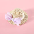 Pet cat wearing princess-style straw hat with woven pearl bow decoration in lafite leaves material