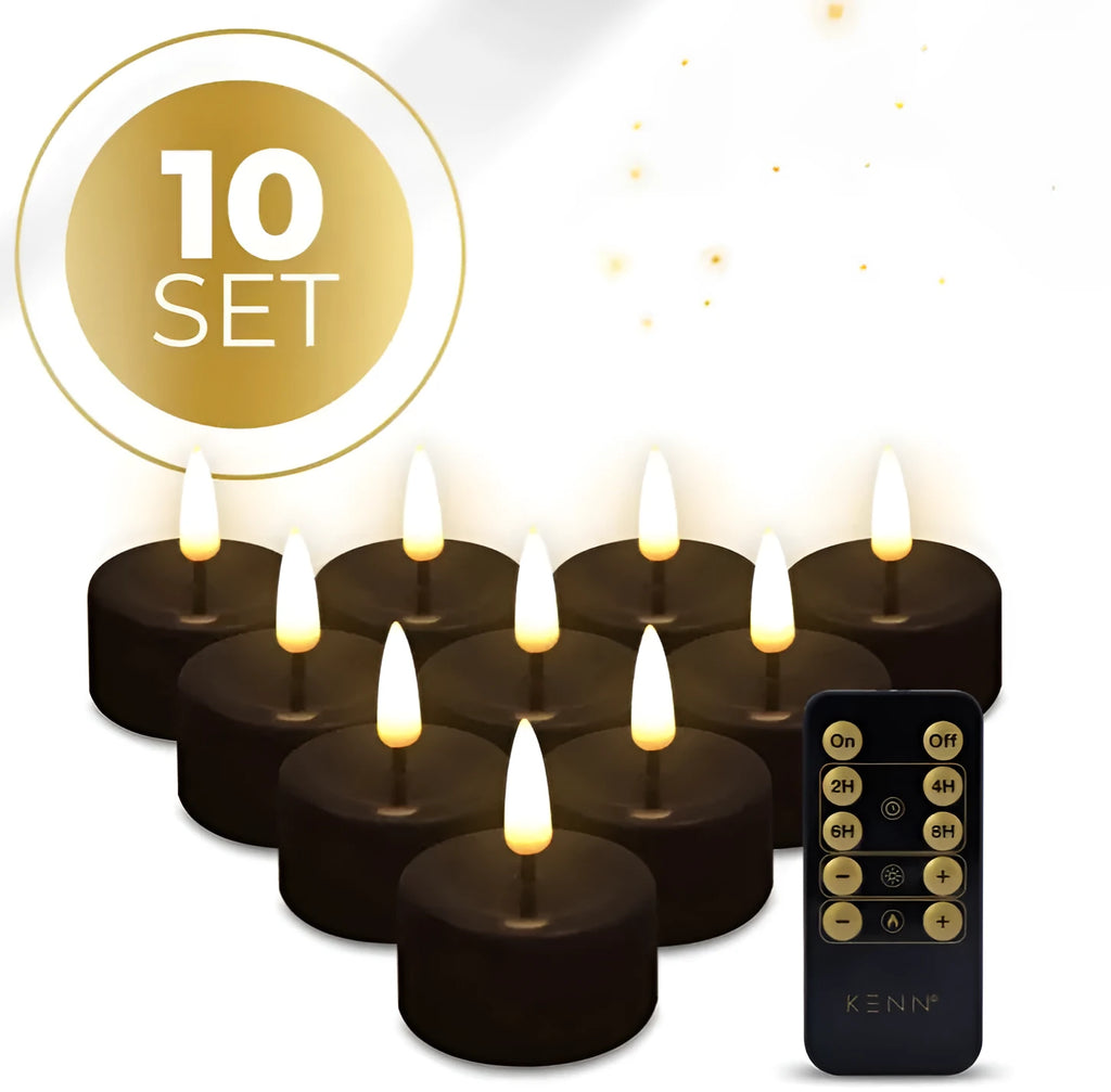 Set of four black plastic LED tealight candles showing warm white flame effect
