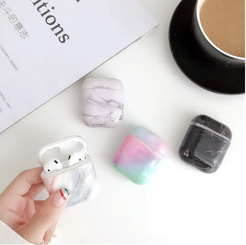 White marble protective case for Apple AirPods charging box showing hard PC construction
