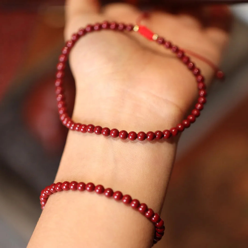 Close-up of a purple gold sand cinnabar bracelet with geometric shapes and auspicious patterns.