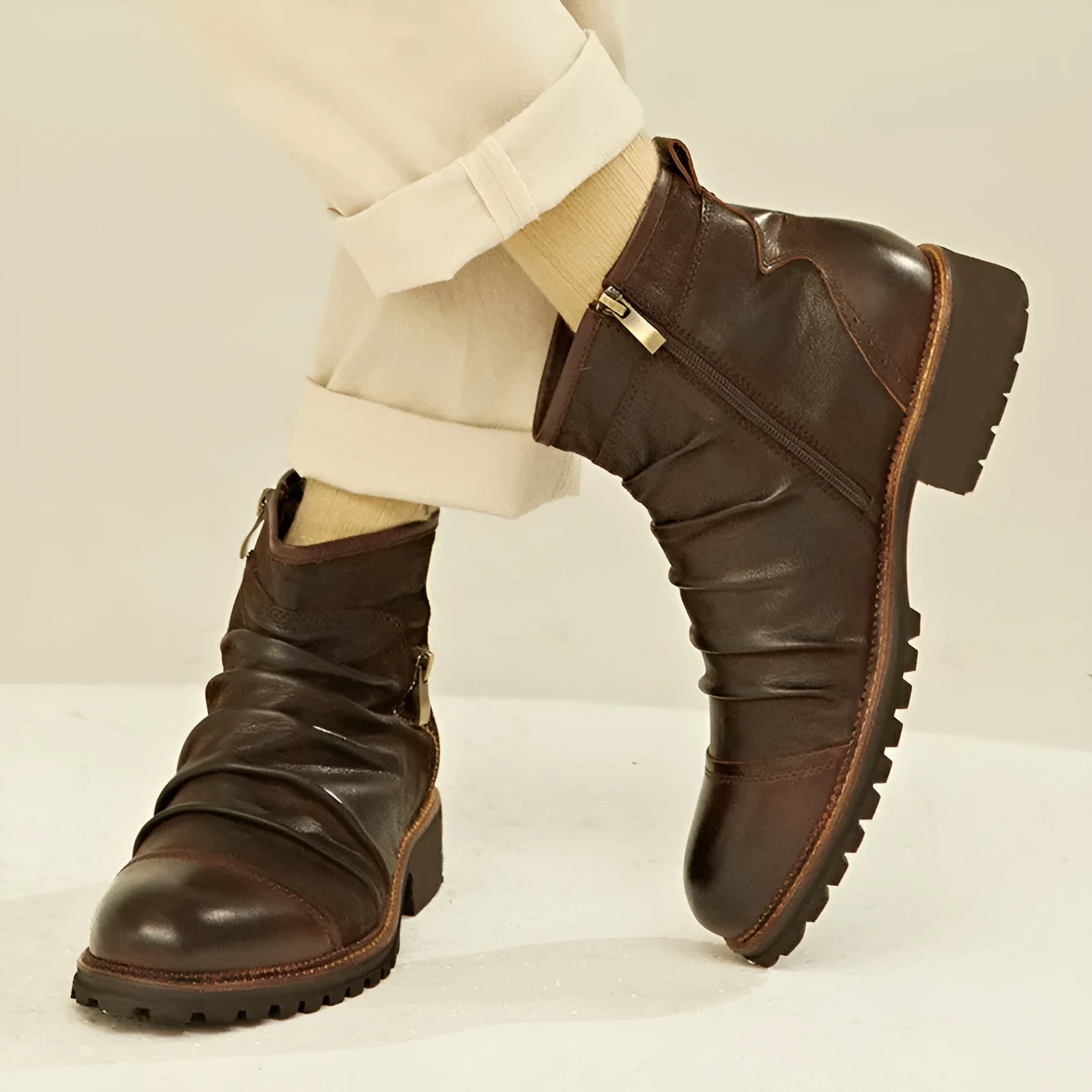 Black and brown cowboy-style Martin boots with a side zipper and round toe.
