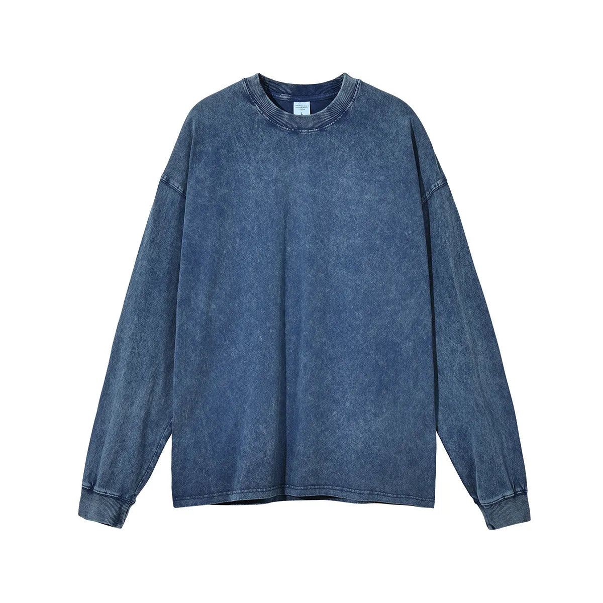 Man wearing a loose fit batik black washed vintage cotton long sleeve pullover.