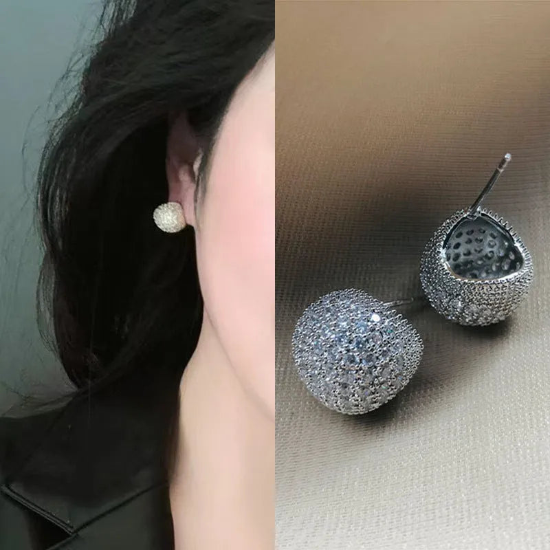 Geometric drop ear clips with diamond-cut golden beans in gold or white colour