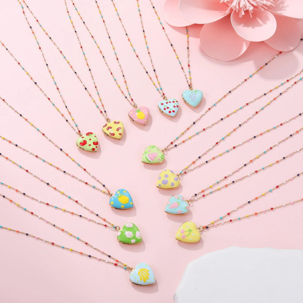 Women's stainless steel necklace with fruit pendant designs in gold plating on adjustable chain