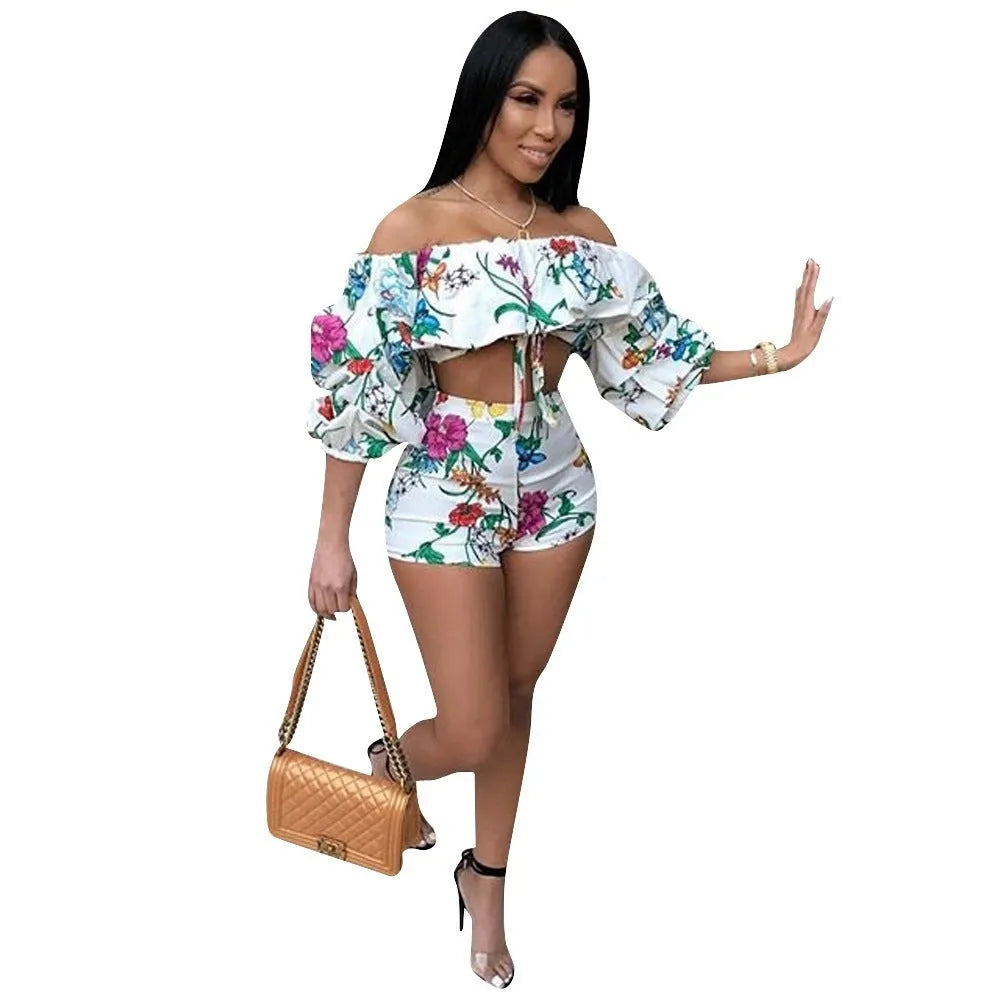 Women's digital print two-piece outfit with pile sleeves on short-sleeve top and matching shorts in multi-colour pattern