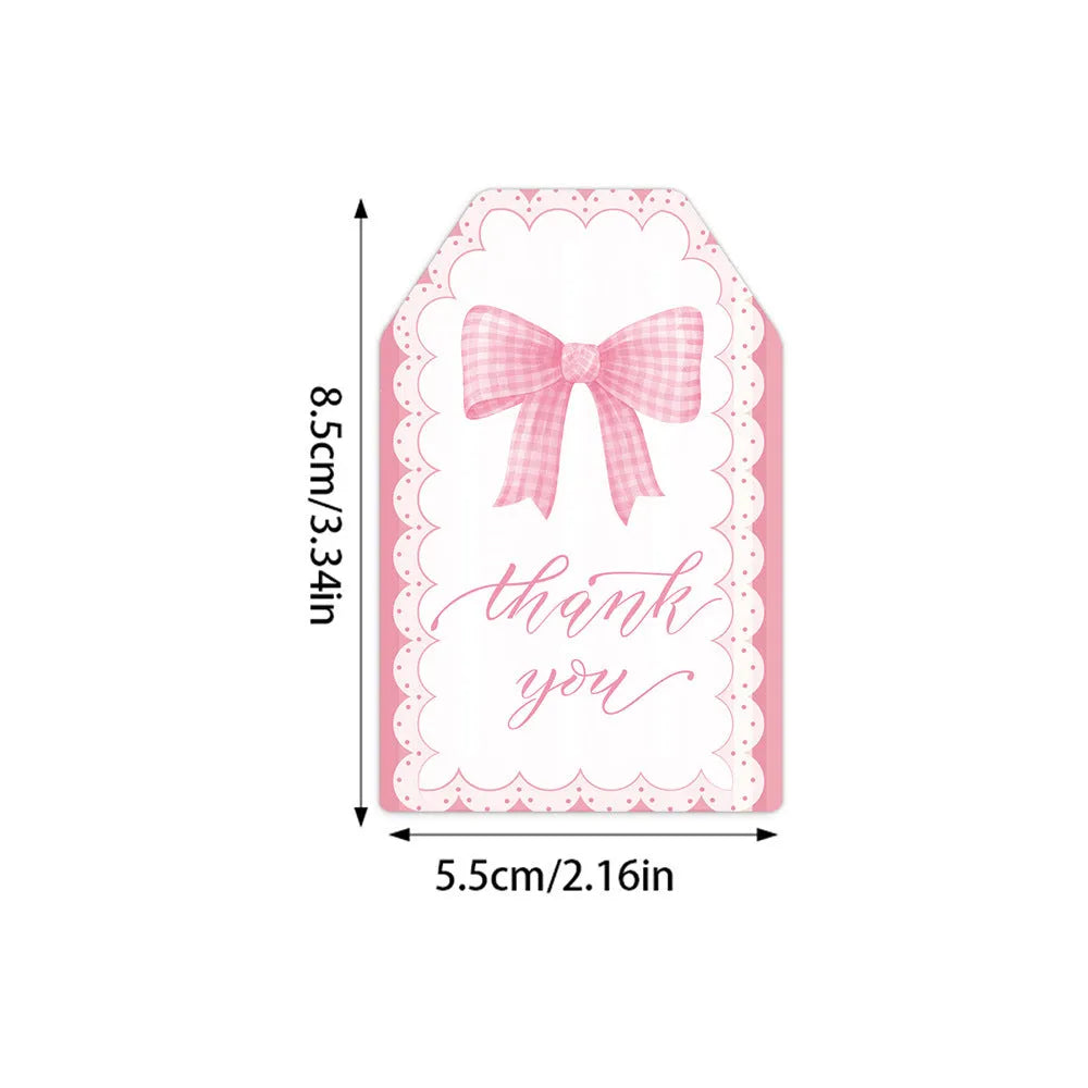 Set of 60 bowknot-shaped paper gift tags with natural hemp rope for birthday parties in three styles.