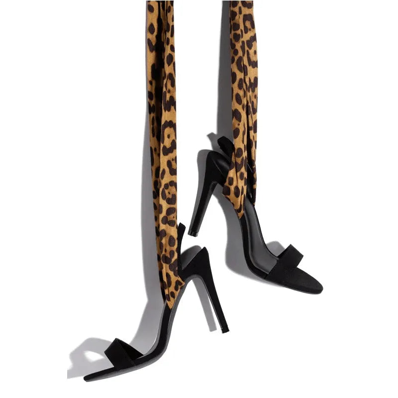 Light brown leopard print high heel sandals with Roman-style cross straps and 8cm+ heel