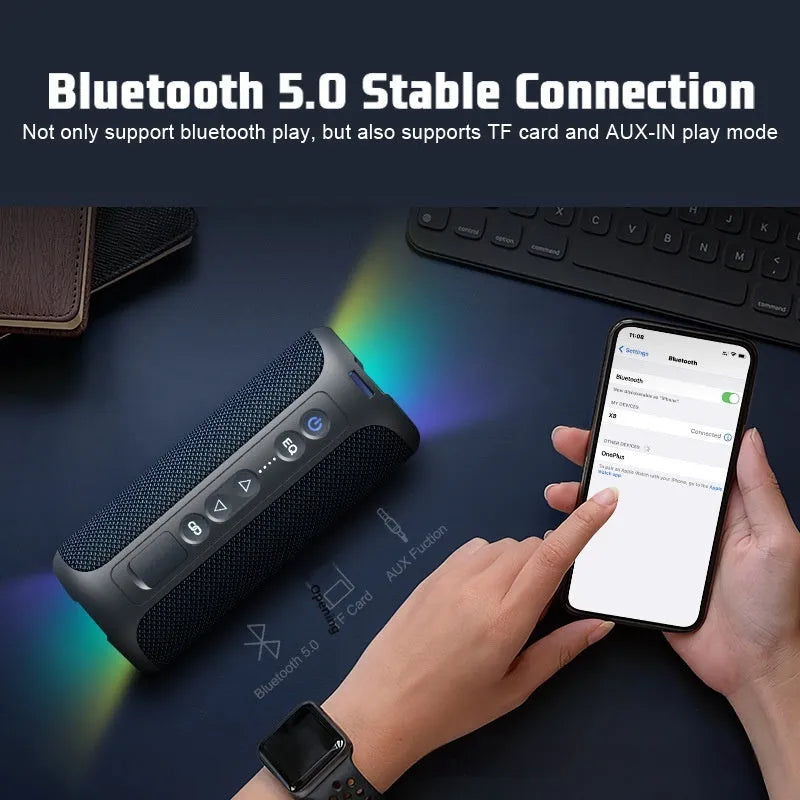 Black and blue fabric Bluetooth speaker with RGB lighting showing waterproof outdoor design