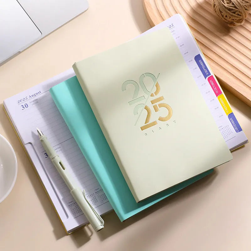 2025 A5 daily planner with faux leather cover, open to show Dorian paper pages.