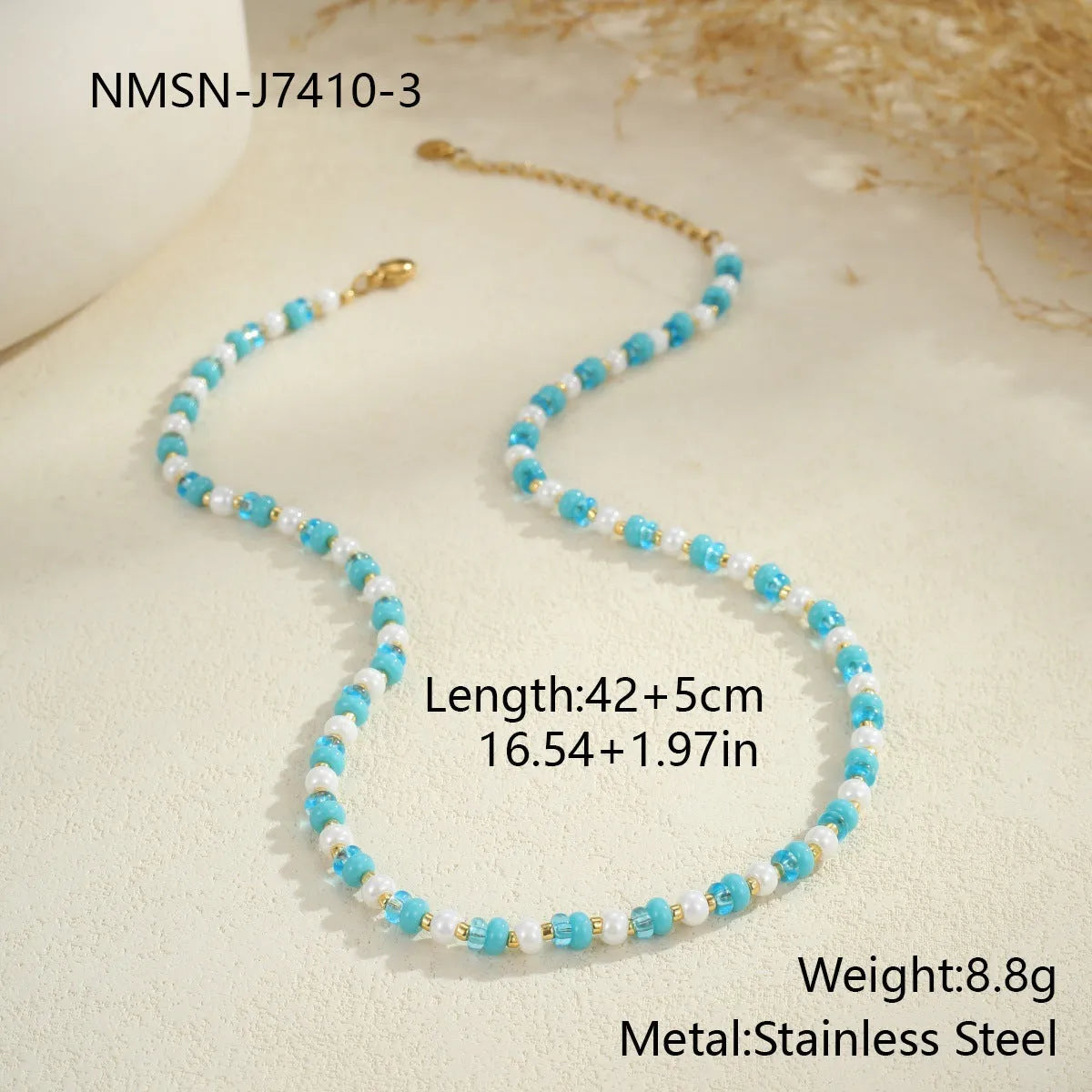18K gold plated stainless steel chain necklace with pink electroplated resin bead pendant on white background