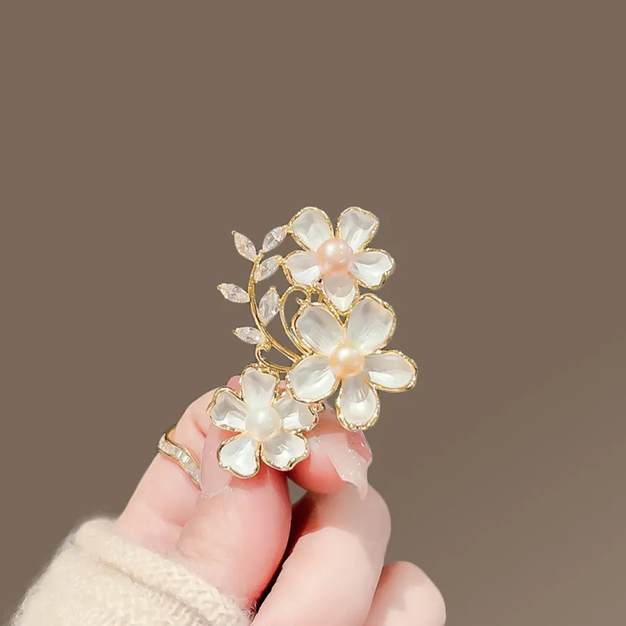 Alloy brooch in natural flower shape with electroplated finish, featuring adjustable and anti-exposure pin closure for women's coats and suits.