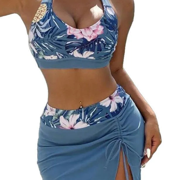 Women's blue solid colour lace-up bikini three-piece set with bra, skirt, and underwear on model