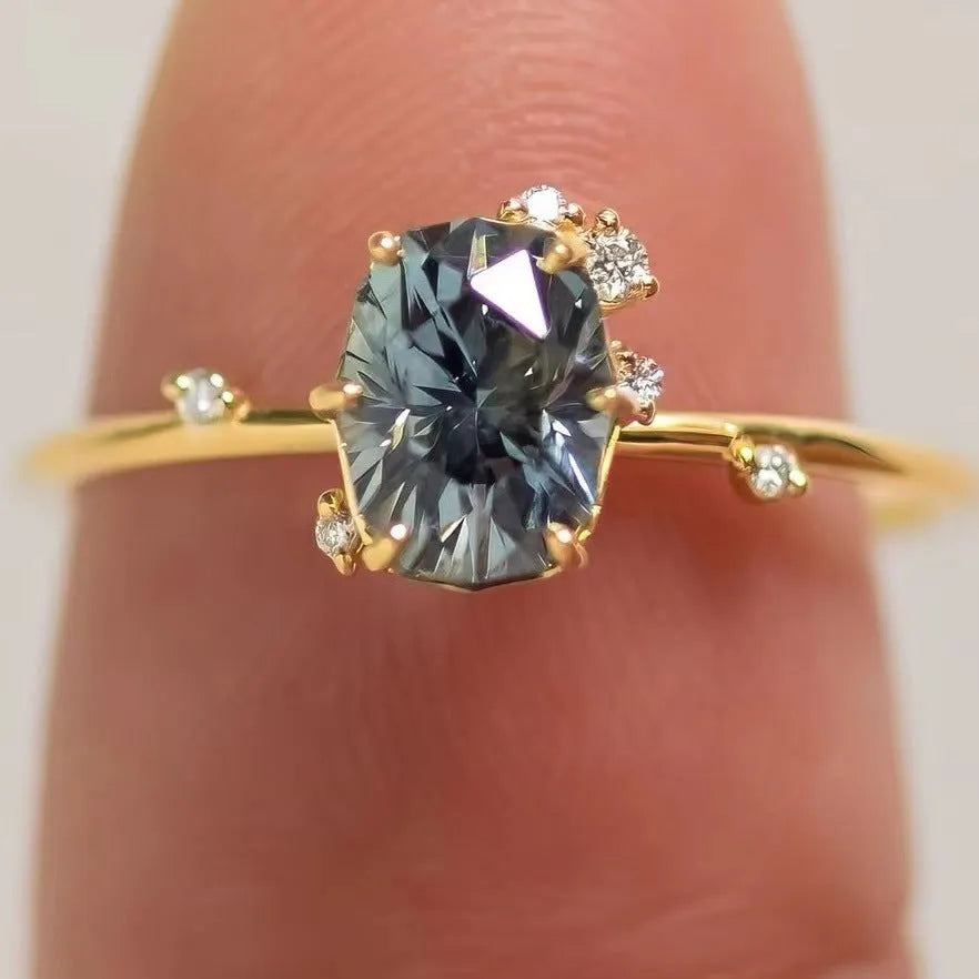 Gold plated floral women's ring with green zircon stone inlay on model finger