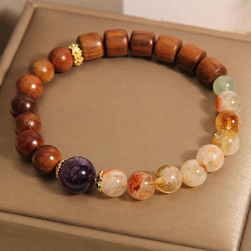 Yellow crystal amethyst bracelet with pearl and rhinestone decorative elements