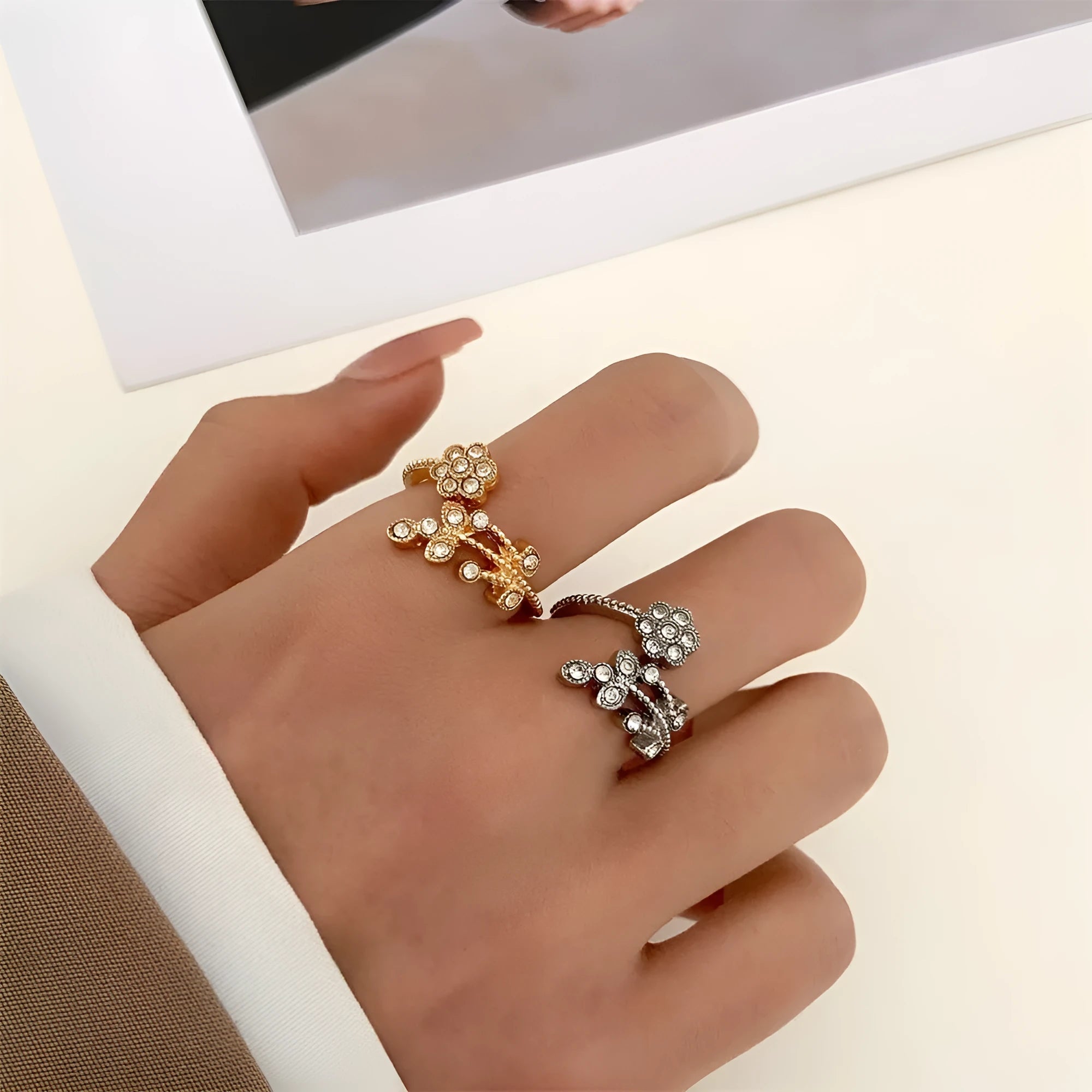 Open mouth copper ring with flower and leaf design in a gold finish