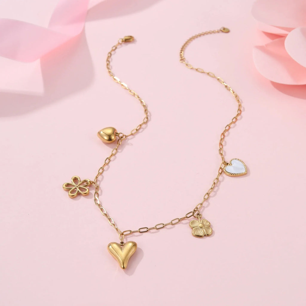 Stainless steel necklace with geometric sun pendant and gold electroplated finish on adjustable chain