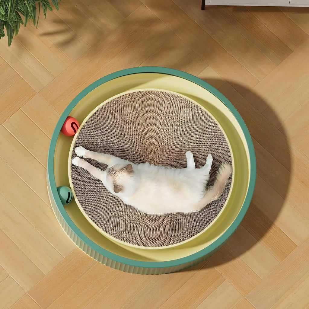 Large green circular cat scratching board with bell balls and a white spring toy in the centre.