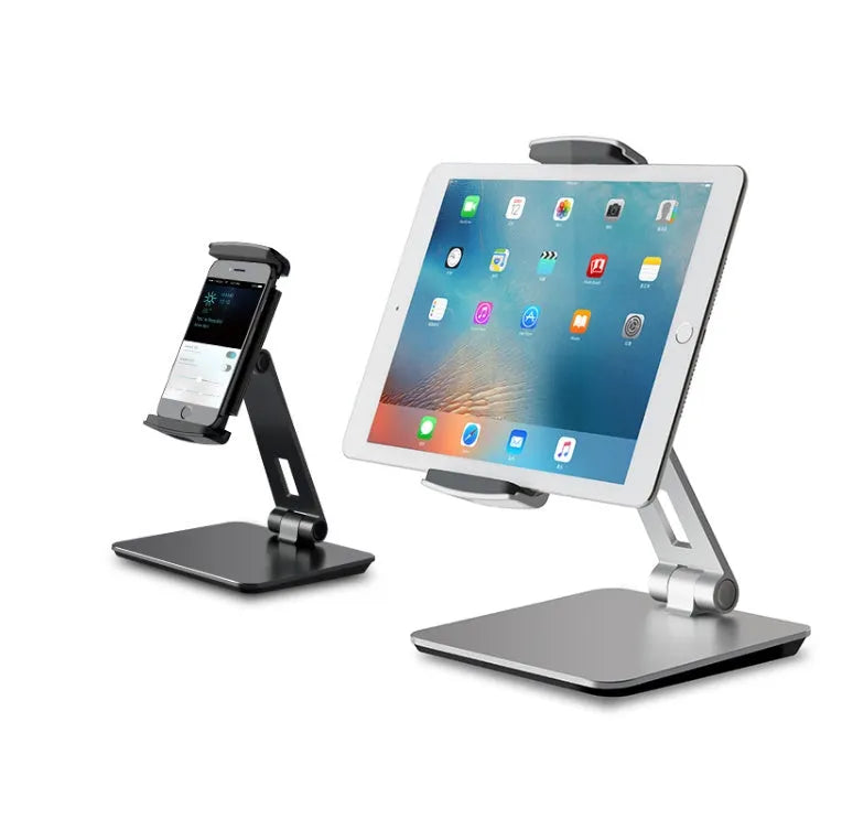 Folding aluminium desktop phone and tablet stand with 360-degree rotation on a wooden desk.