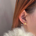 Large geometric pearl stud earrings with retro styling and eight-awm star detailing in silver