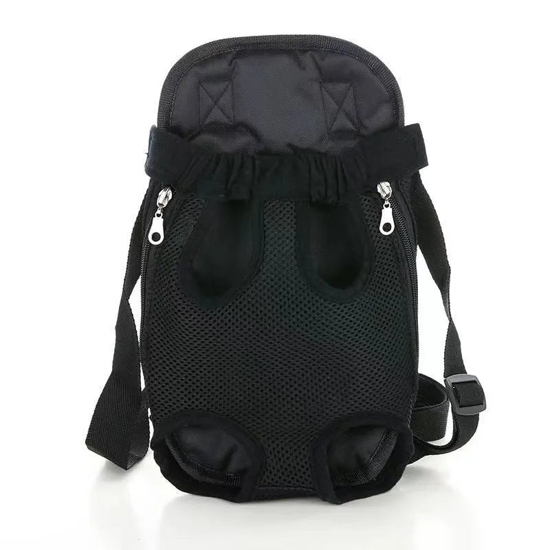 A person wearing a black breathable dog carrier backpack with a small dog inside, showing the open-top design and mesh panels.