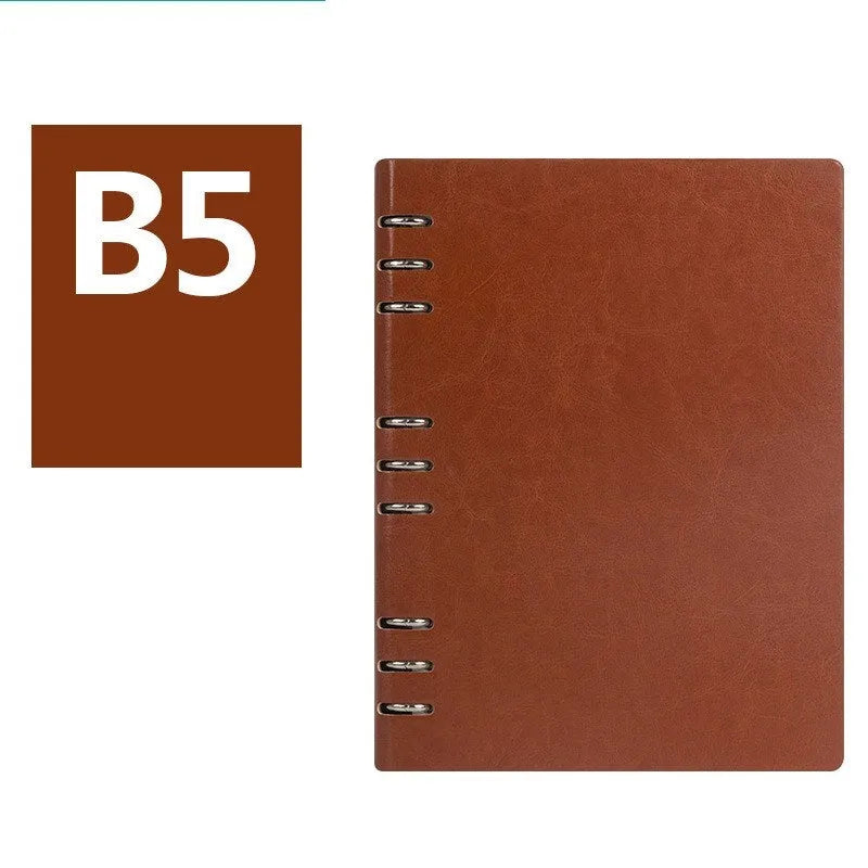 Loose-leaf business notebook with imitation leather cover in multiple colours, open to show beige paper.