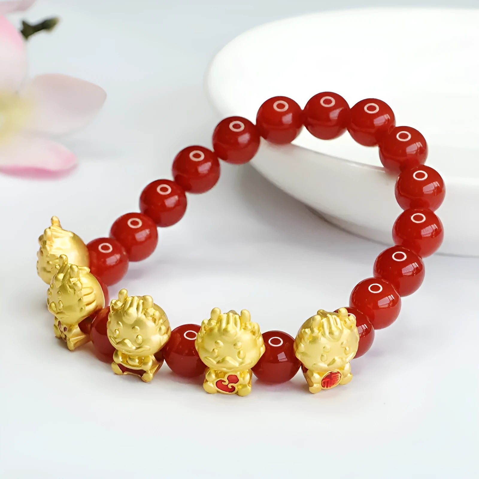 Red agate bracelet with dragon charm in traditional Chinese jewellery design