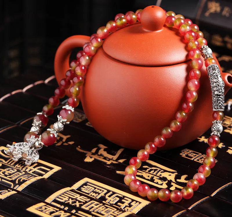 Watermelon crystal bracelet with Chinese knot design in 6mm or 8mm elephant style beads