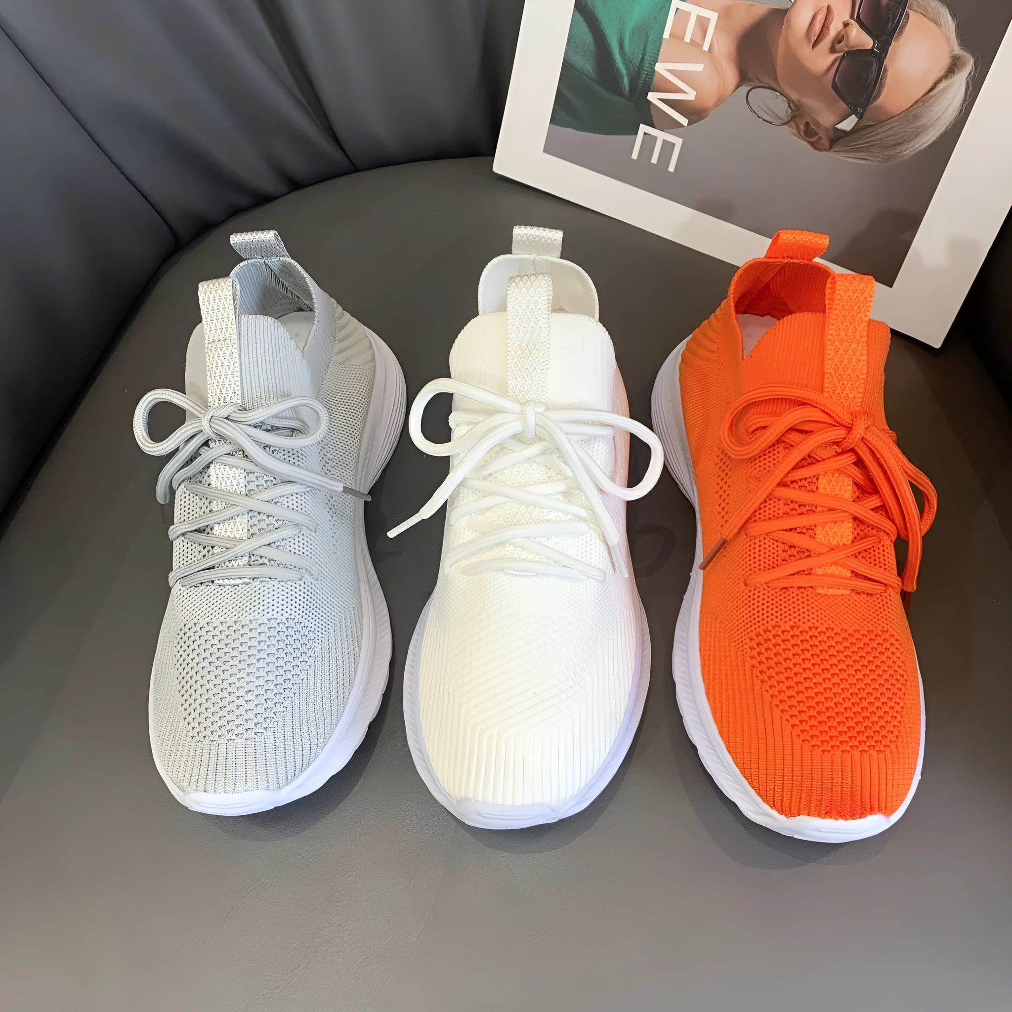 Women's low-top mesh running shoes in creamy white with a rubber sole and round toe.