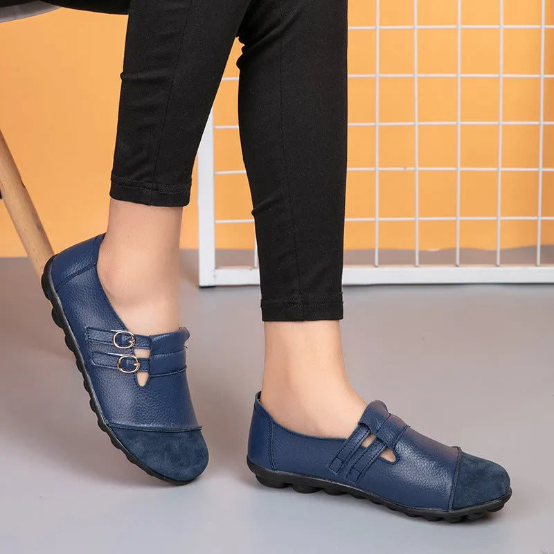 Women's casual flat shoes with Velcro fastening in black, showing round toe and beef tendon sole