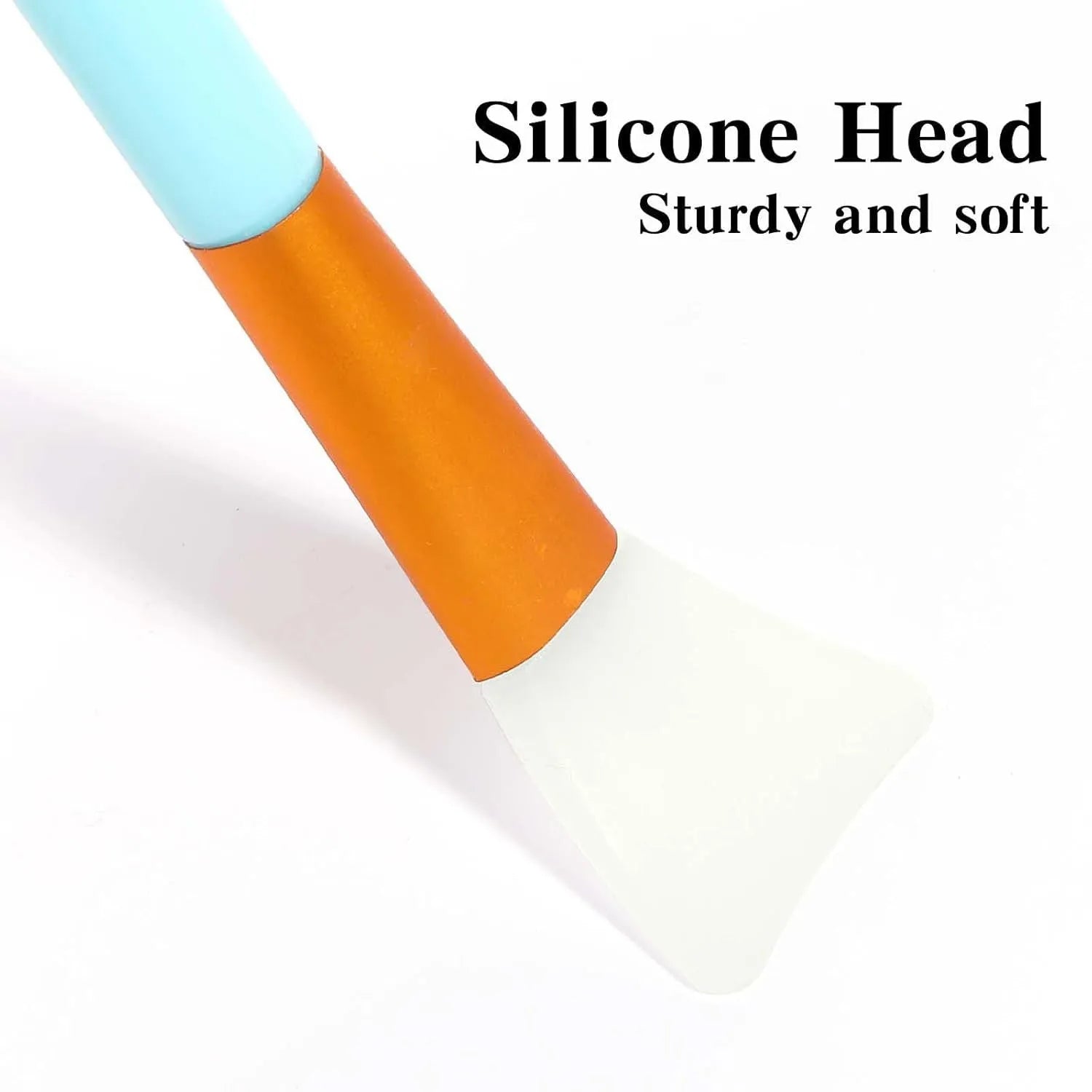 Reusable silicone face and body mask applicator spatula in assorted colours on a clean surface