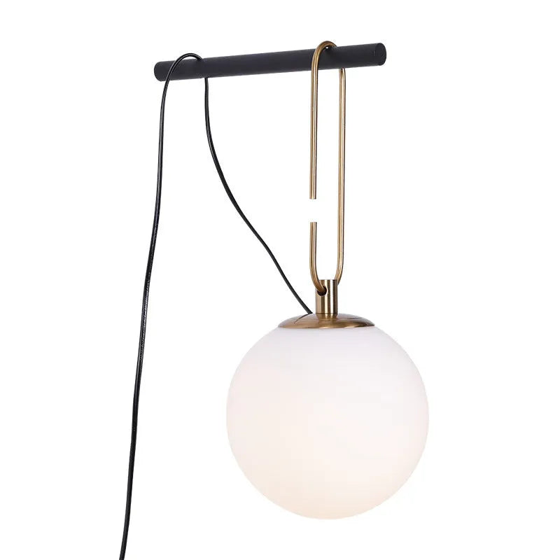 Modern Nordic glass wall lamp with three light colour options on a contemporary wall