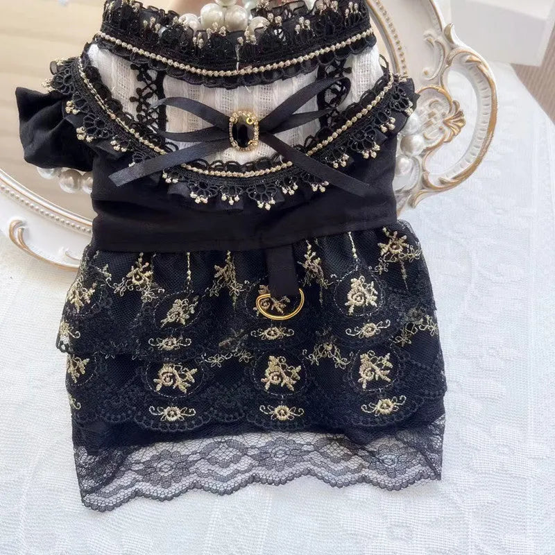 Golden Gothic princess skirt costume for a small dog on a mannequin, showing the tiered skirt design.