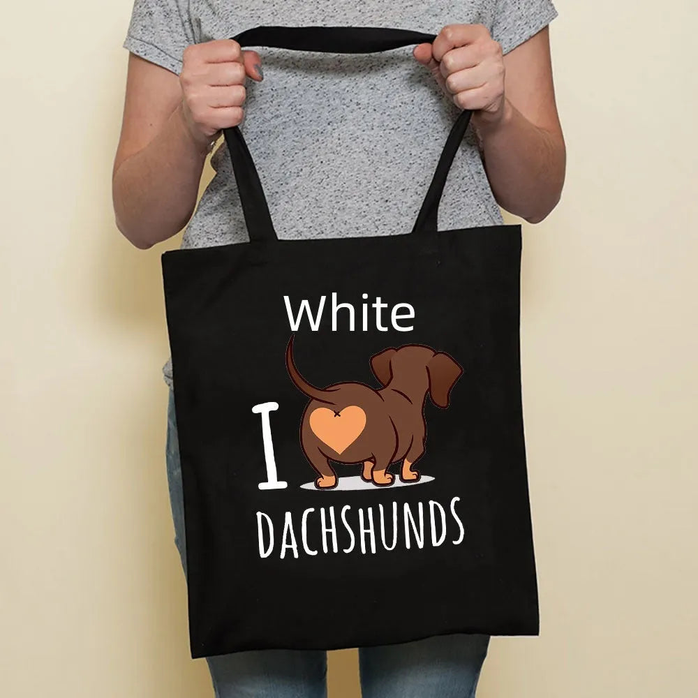 Sausage dog printed canvas bag in black with white dog design on front, sturdy tote for everyday use