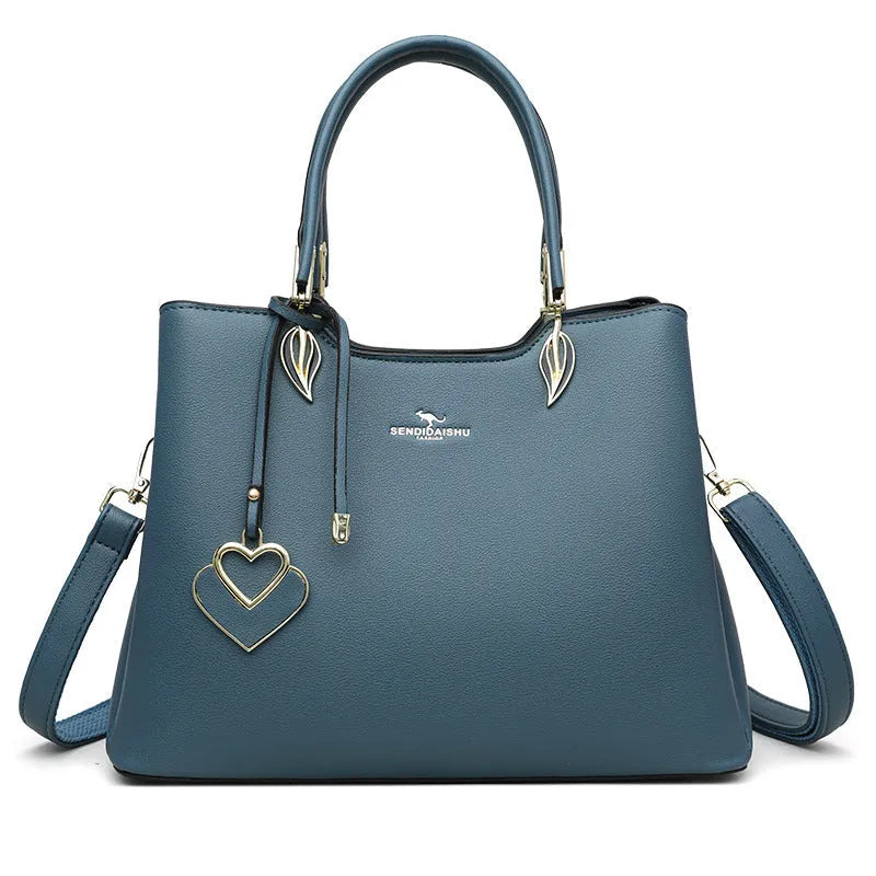 Women's black PU leather multi-compartment shoulder messenger bag with adjustable strap.