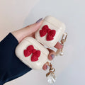 Beige AirPods case with red bow shell design, clamshell TPU earphone cover
