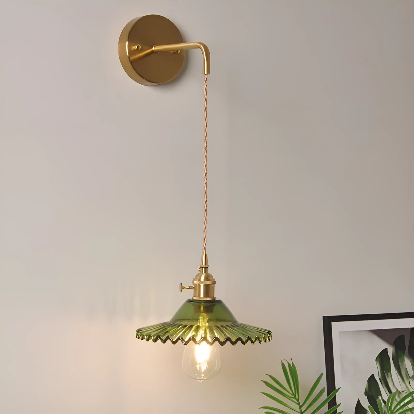 Retro brass lotus wall lamp with a glass shade in a choice of six colours.