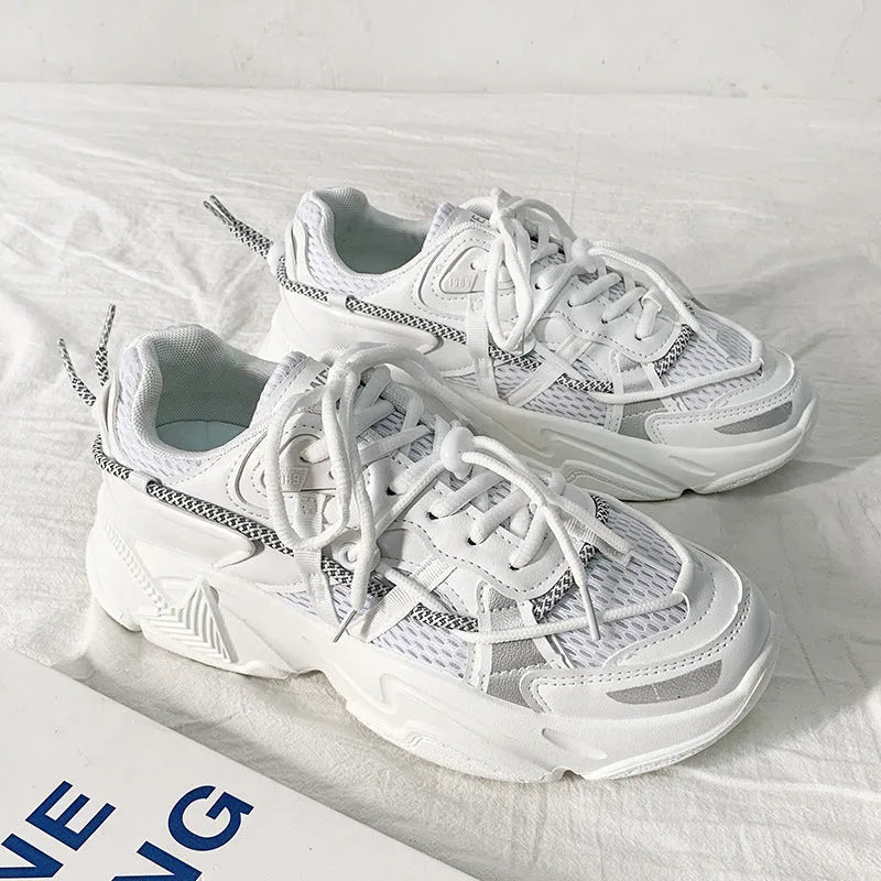 Men's white platform dad shoes with lace-up front, shown on a light background