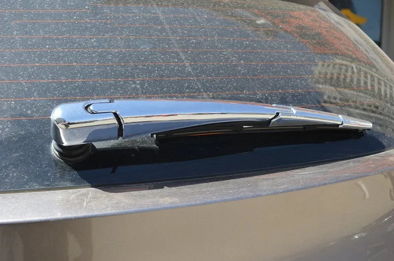 Set of four silvery ABS plastic rear window wiper cover trims for a 2010 Hyundai.